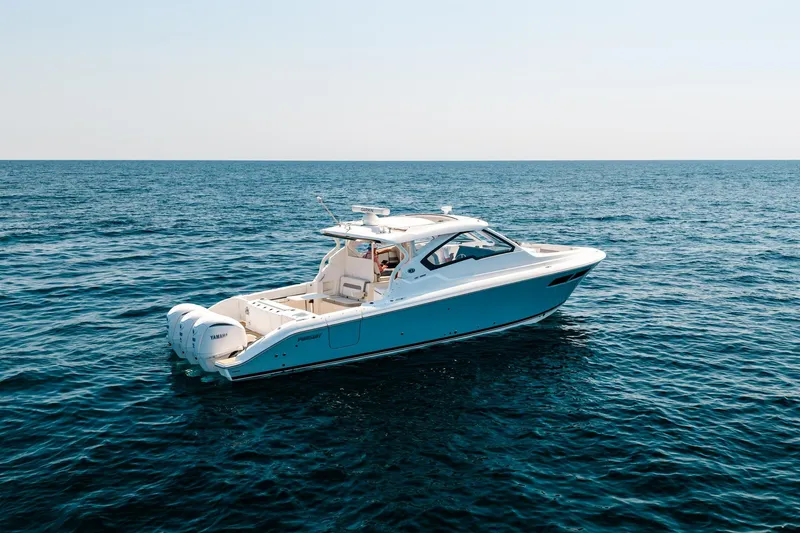 Slide: The Image of 2022 Pursuit DC 365 Dual Console boat cruising on open sea. - 78