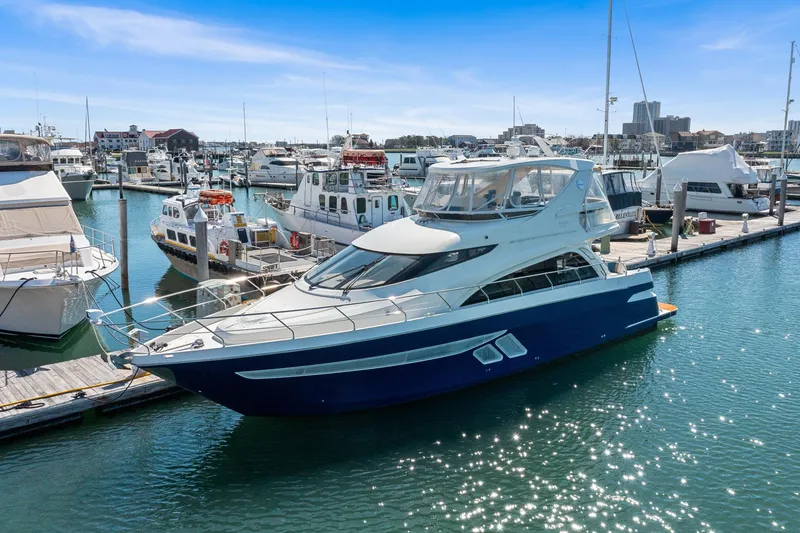 The Image of Luxury 2007 Marquis 55 LS yacht docked in a sunny marina. - 0