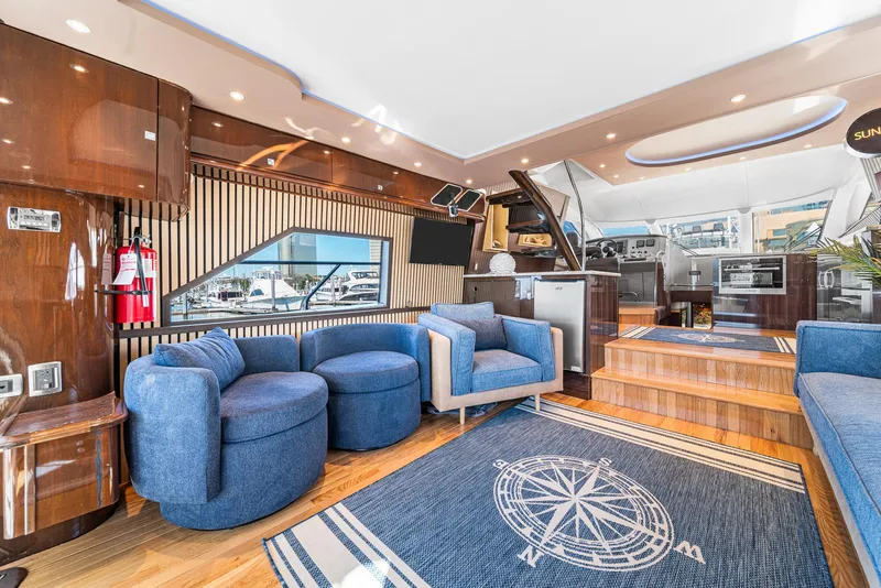 Slide: The Image of Luxurious interior of a 2007 Marquis 55 LS yacht with modern furnishings and nautical decor. - 18