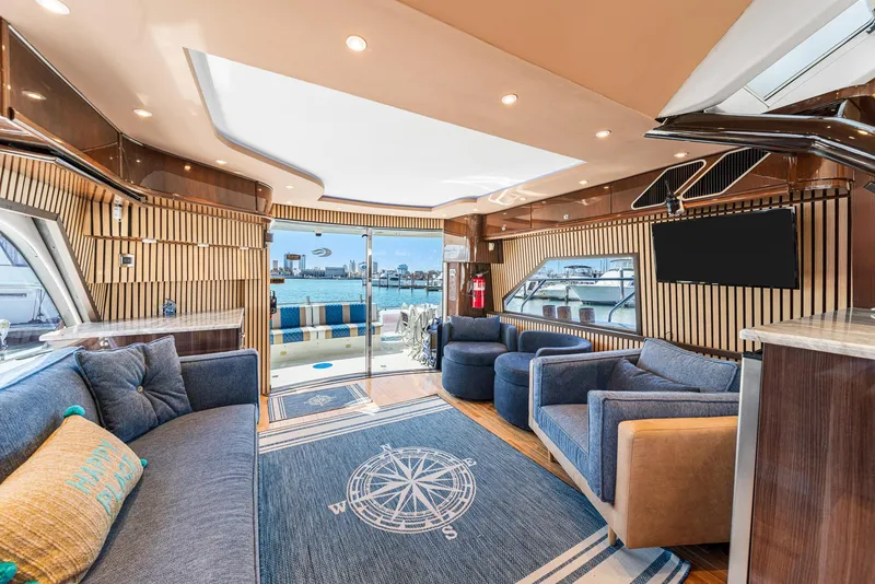 Slide: The Image of Luxurious interior of a 2007 Marquis 55 LS yacht with modern seating and nautical decor. - 21