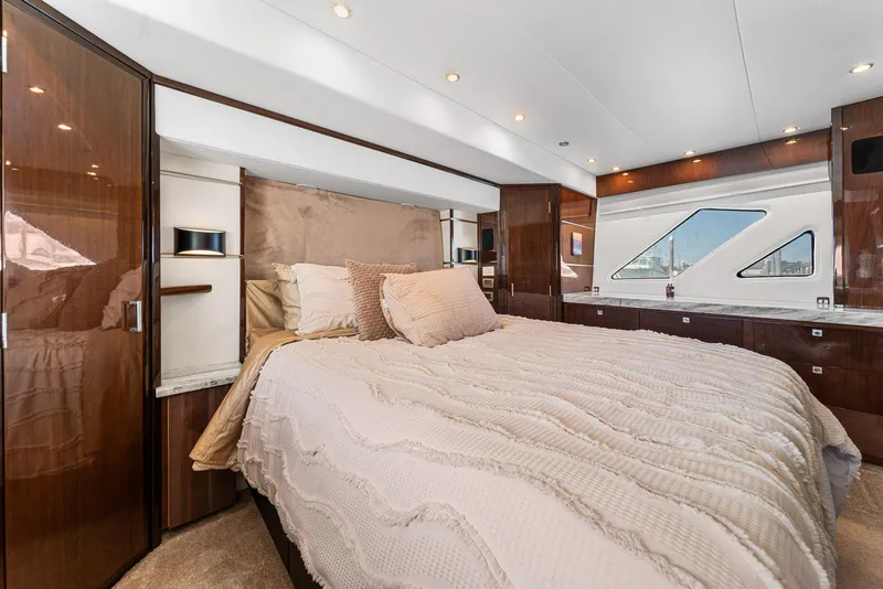 Slide: The Image of Luxurious bedroom interior of 2007 Marquis 55 LS yacht with elegant wood finishes. - 31
