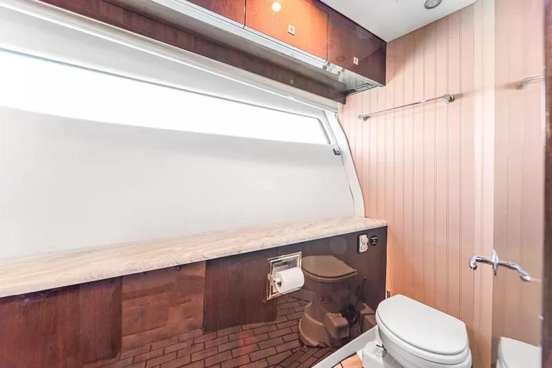 Slide: The Image of Luxurious bathroom interior of 2007 Marquis 55 LS yacht with modern fixtures and wood accents. - 35