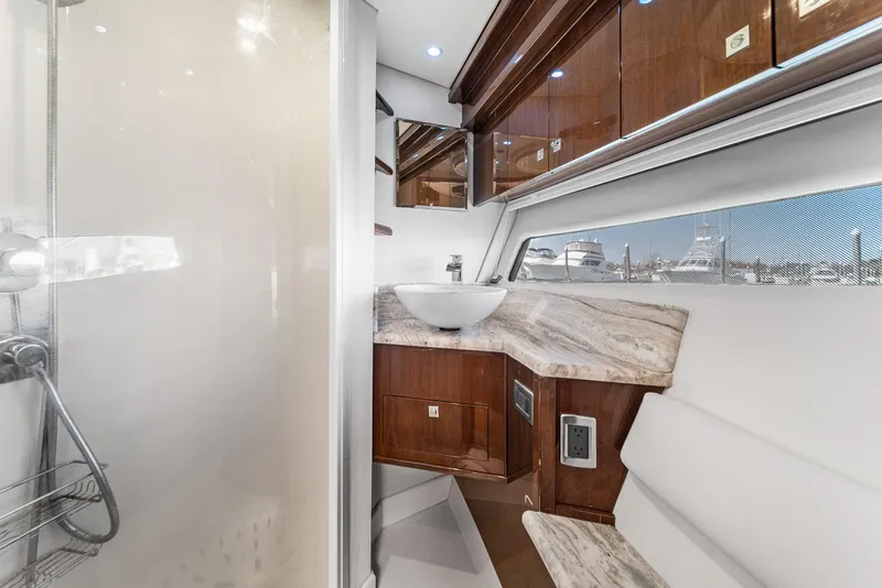 Slide: The Image of Luxurious bathroom interior of 2007 Marquis 55 LS yacht with modern fixtures and wood accents. - 43