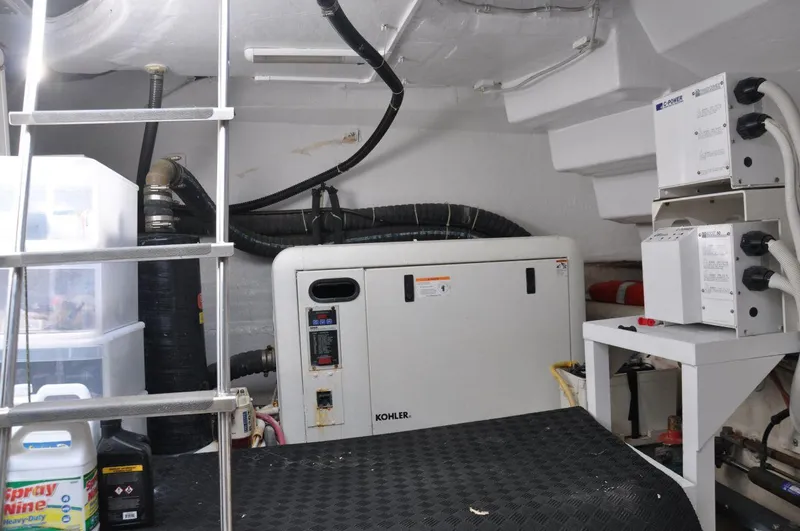 Slide: The Image of Engine room of 2007 Marquis 55 LS yacht with generator and equipment. - 46