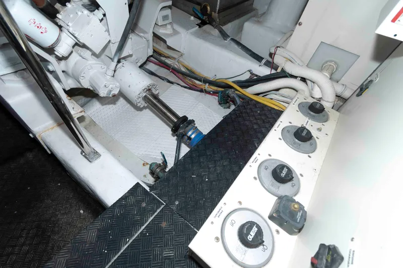 Slide: The Image of Engine room of a 2007 Marquis 55 LS yacht, showing mechanical components and wiring. - 51