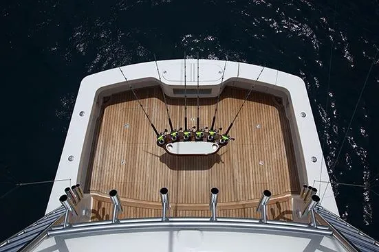 Slide: The Image of 2017 Viking 52 Sport Tower yacht on water, clear sky background. - 10