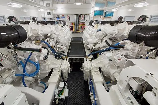 Slide: The Image of 2017 Viking 52 Sport Tower yacht on calm water, surrounded by palm trees. - 12