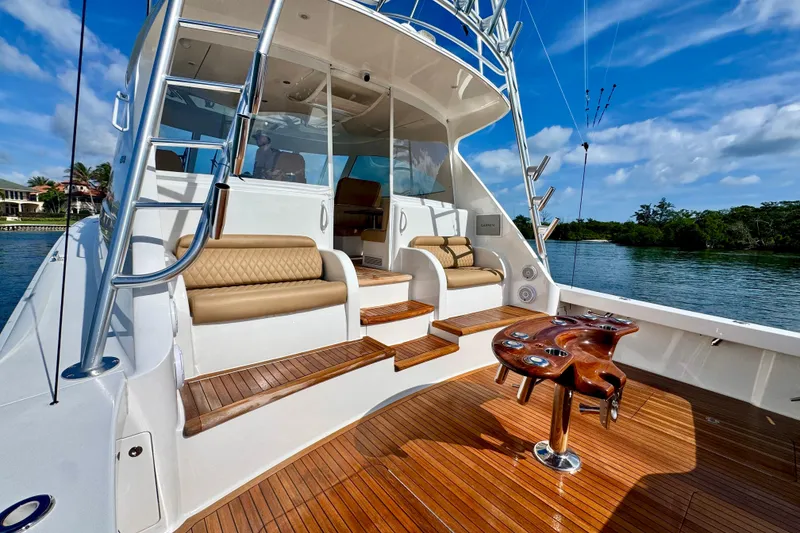 Slide: The Image of 2017 Viking 52 Sport Tower yacht with teak deck and luxurious seating. - 14
