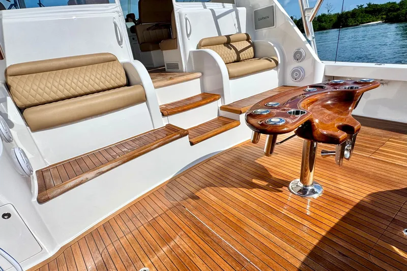 Slide: The Image of Luxurious 2017 Viking 52 Sport Tower yacht interior with teak flooring and elegant seating. - 15