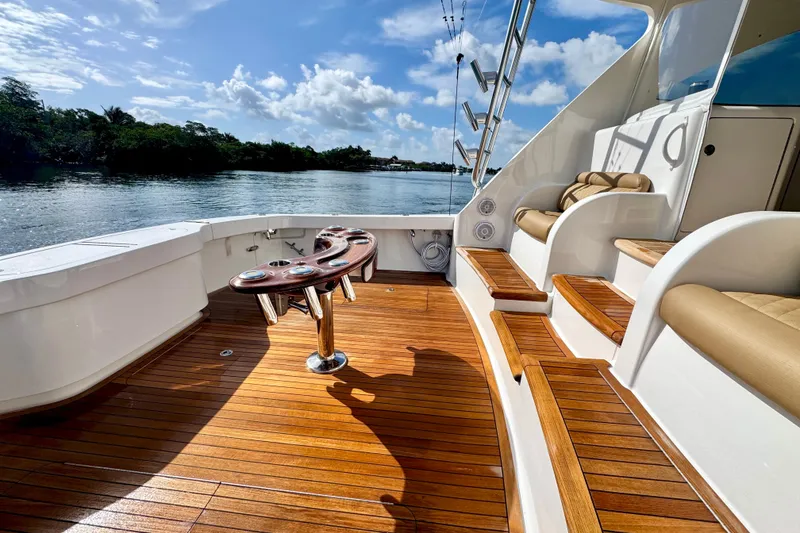 Slide: The Image of Luxurious 2017 Viking 52 Sport Tower yacht deck with wooden flooring and seating. - 21