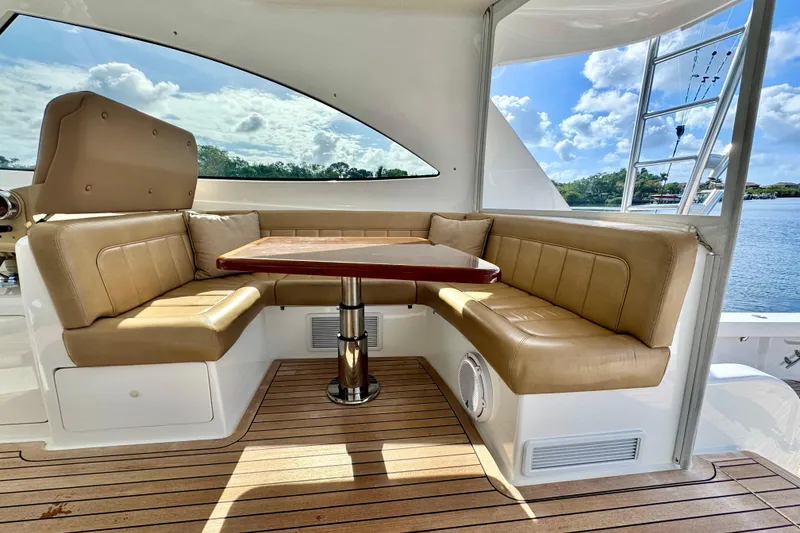 Slide: The Image of Luxurious seating area on 2017 Viking 52 Sport Tower yacht with scenic water view. - 26