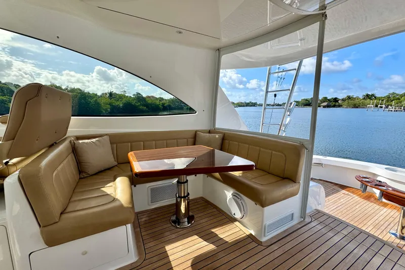 Slide: The Image of Luxurious seating area on 2017 Viking 52 Sport Tower yacht with scenic water view. - 27