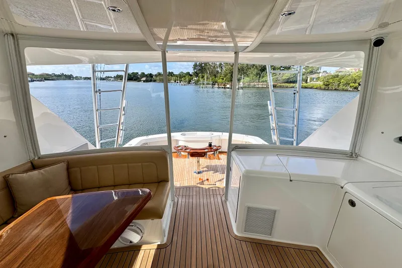 Slide: The Image of Interior view of 2017 Viking 52 Sport Tower yacht with scenic water backdrop. - 28