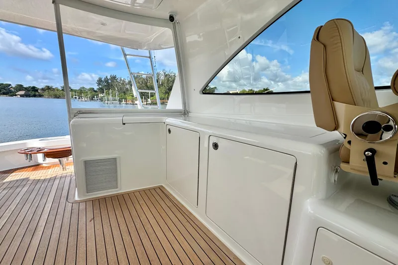 Slide: The Image of 2017 Viking 52 Sport Tower interior with sleek design and waterfront view. - 30
