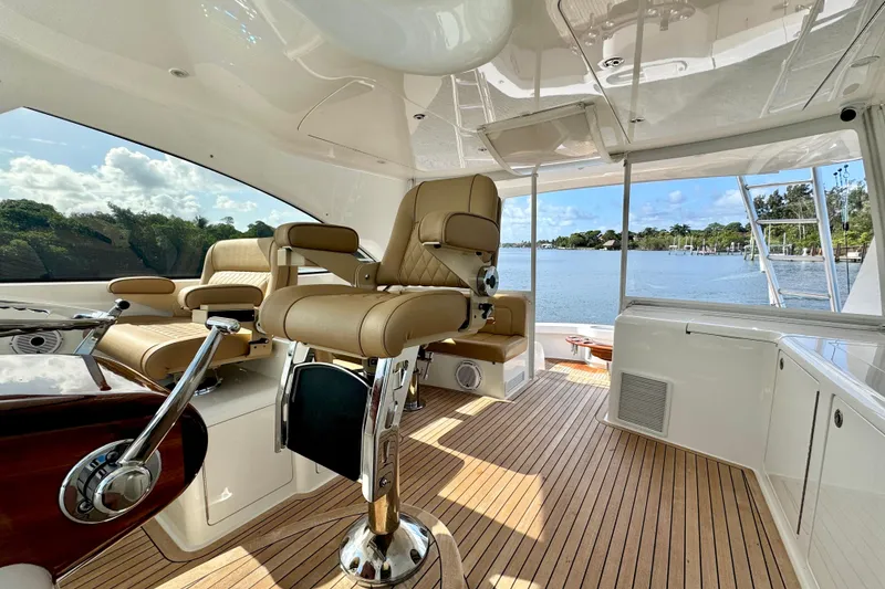 Slide: The Image of Luxurious interior of 2017 Viking 52 Sport Tower yacht with leather seating and scenic water view. - 31