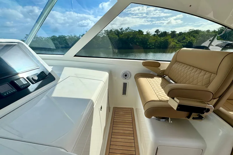 Slide: The Image of Luxurious interior of 2017 Viking 52 Sport Tower yacht with leather seating and control panel. - 36