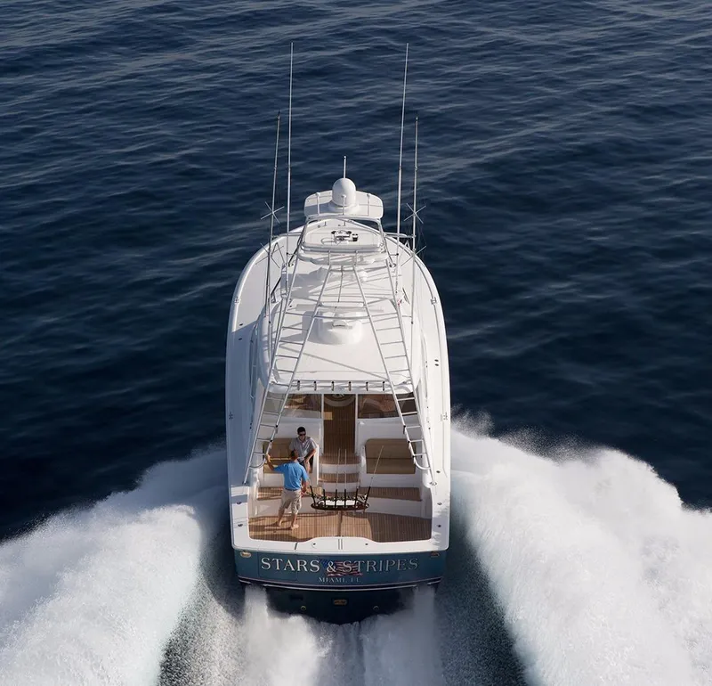 Slide: The Image of 2017 Viking 52 Sport Tower yacht cruising on a sunny day. - 4