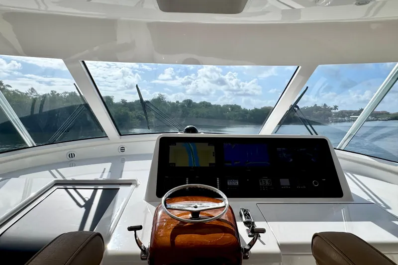 Slide: The Image of Interior view of 2017 Viking 52 Sport Tower yacht helm with navigation screens. - 41
