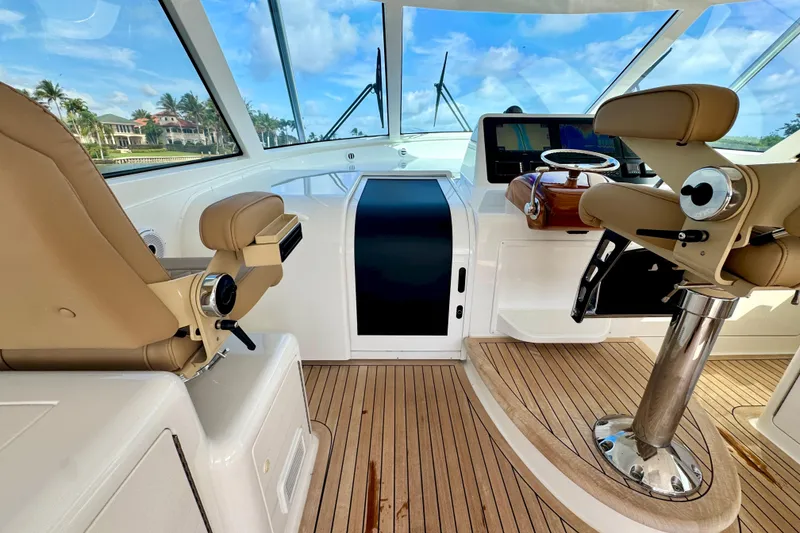 Slide: The Image of Interior of 2017 Viking 52 Sport Tower yacht with helm and seating. - 46
