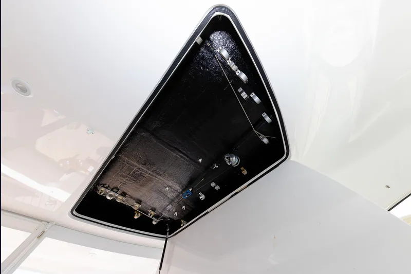 Slide: The Image of Underside view of 2017 Viking 52 Sport Tower boat's hatch mechanism. - 49