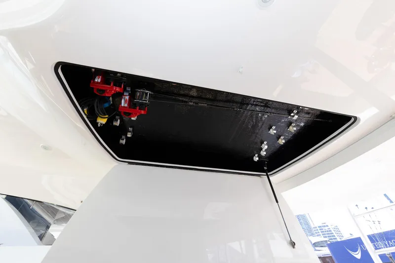 Slide: The Image of 2017 Viking 52 Sport Tower electrical compartment with cables and connectors. - 50