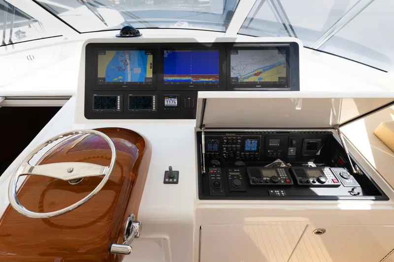 Slide: The Image of Helm of 2017 Viking 52 Sport Tower with advanced navigation and control systems. - 51
