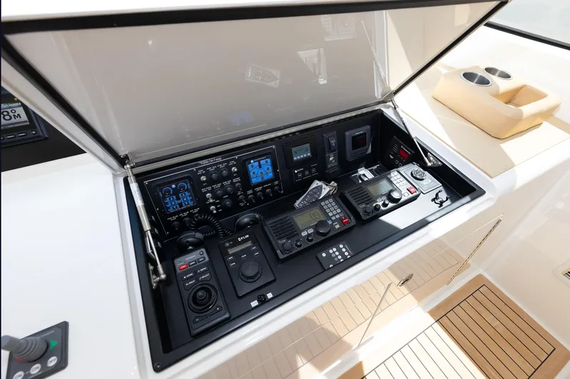 Slide: The Image of Control panel of 2017 Viking 52 Sport Tower yacht with advanced navigation equipment. - 52