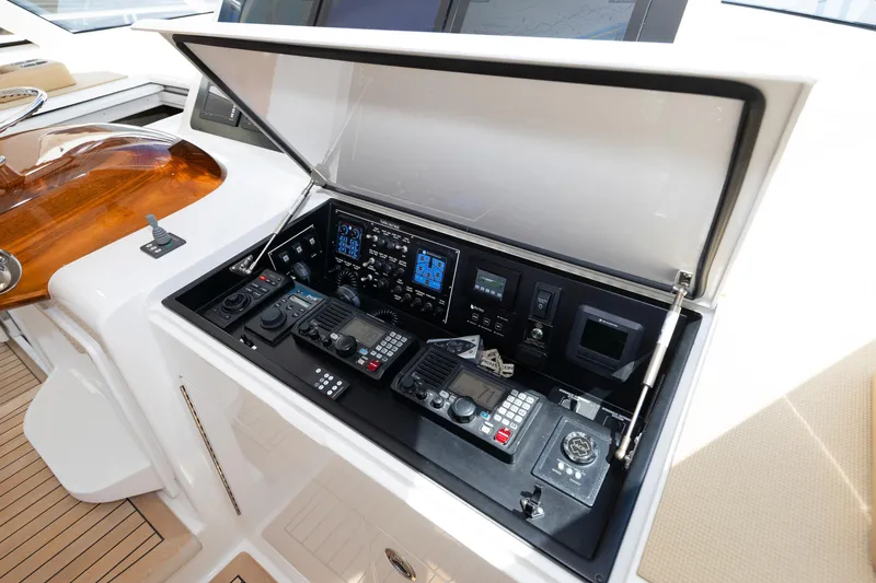 Slide: The Image of 2017 Viking 52 Sport Tower control panel with advanced navigation equipment. - 53