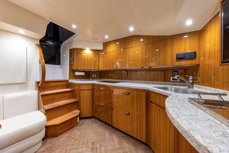 Slide: The Image of Luxurious interior of 2017 Viking 52 Sport Tower yacht with modern kitchen design. - 56