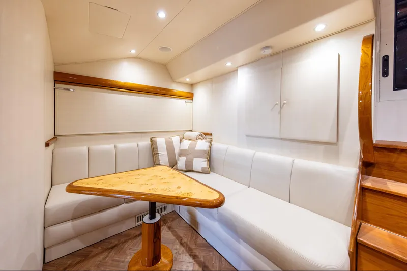 Slide: The Image of Luxurious interior of 2017 Viking 52 Sport Tower with elegant seating and wooden accents. - 57