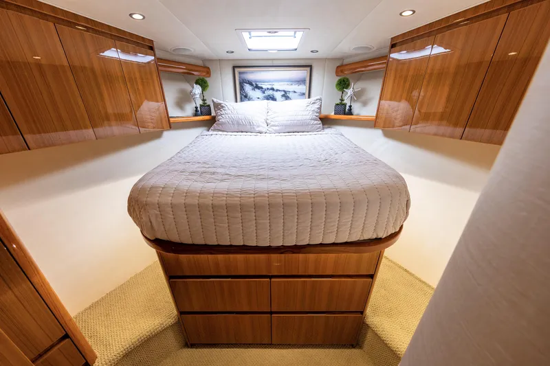 Slide: The Image of Luxurious cabin interior of 2017 Viking 52 Sport Tower yacht with elegant wood finishes. - 62