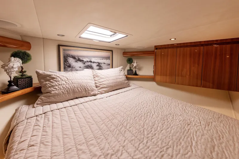 Slide: The Image of Luxurious cabin interior of 2017 Viking 52 Sport Tower yacht with elegant bedding. - 65
