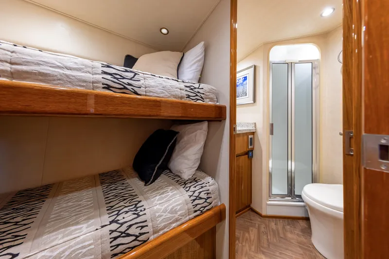 Slide: The Image of Interior of 2017 Viking 52 Sport Tower with bunk beds and compact bathroom. - 69