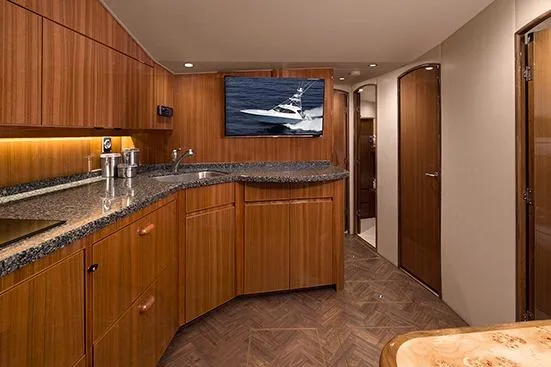 Slide: The Image of 2017 Viking 52 Sport Tower yacht on water, clear sky background. - 7