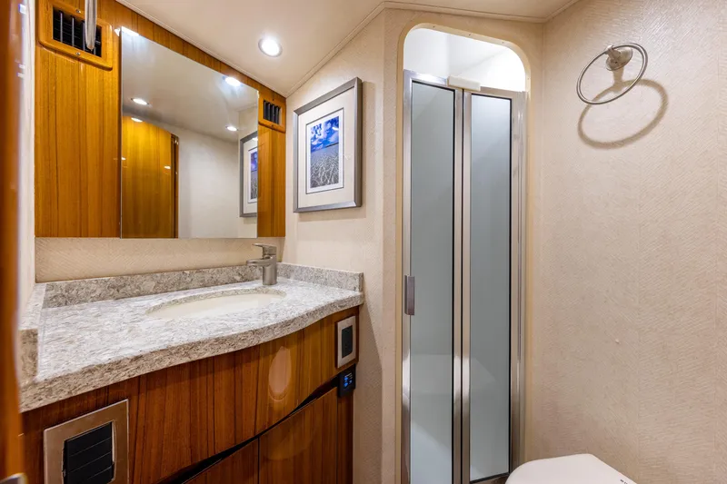 Slide: The Image of Luxurious bathroom in 2017 Viking 52 Sport Tower yacht with modern fixtures and elegant design. - 71