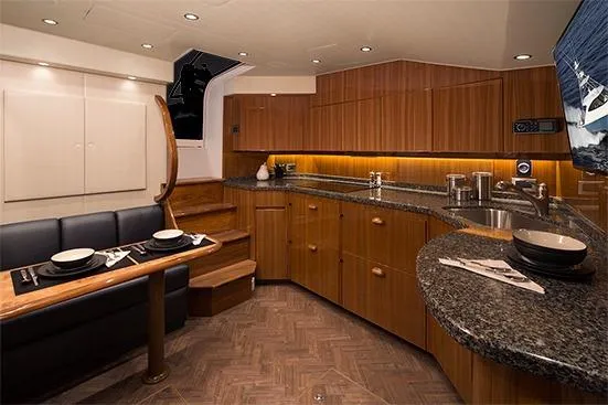 Slide: The Image of 2017 Viking 52 Sport Tower yacht cruising under a clear blue sky. - 8