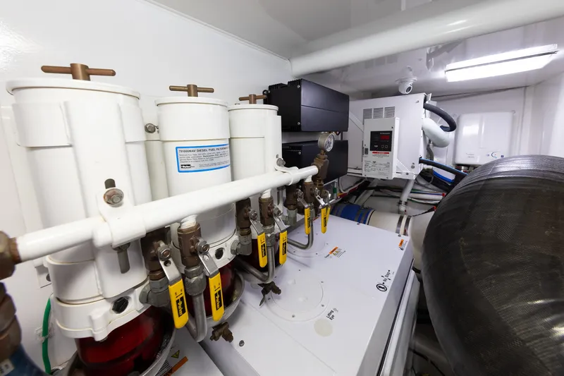 Slide: The Image of Engine room of 2017 Viking 52 Sport Tower with fuel filters and control systems. - 81