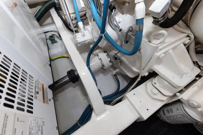 Slide: The Image of Engine room of 2017 Viking 52 Sport Tower with visible machinery and cables. - 82