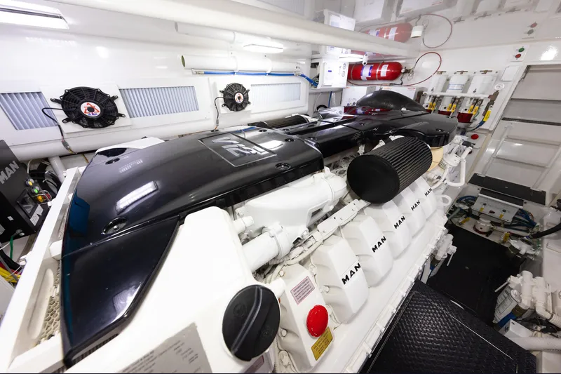 Slide: The Image of Engine room of 2017 Viking 52 Sport Tower yacht, featuring MAN engines and ventilation system. - 85