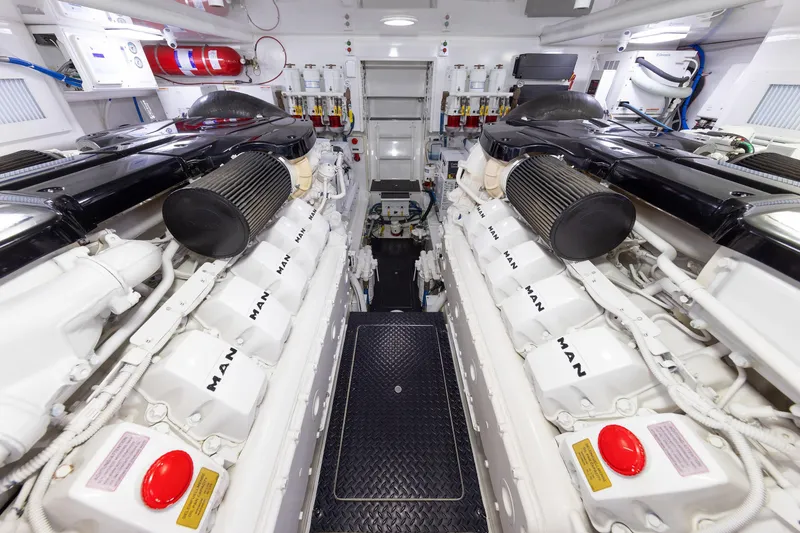 Slide: The Image of Engine room of 2017 Viking 52 Sport Tower yacht, featuring dual MAN engines. - 86