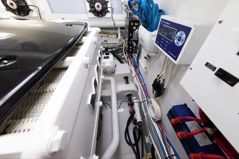 Slide: The Image of Engine room of 2017 Viking 52 Sport Tower with advanced equipment and wiring. - 88