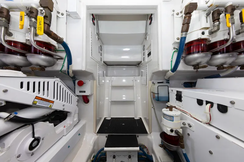 Slide: The Image of Engine room of 2017 Viking 52 Sport Tower with mechanical components and piping. - 91