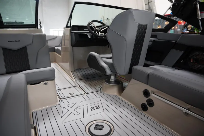 Slide: The Image of Interior of 2025 MasterCraft XT22 boat with sleek seating and modern design. - 12
