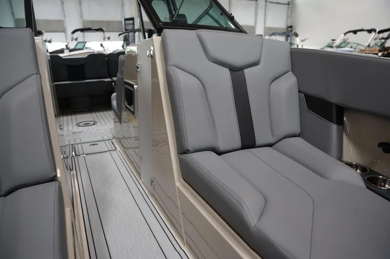 Slide: The Image of 2025 MasterCraft XT22 interior with sleek gray seating and modern design. - 9