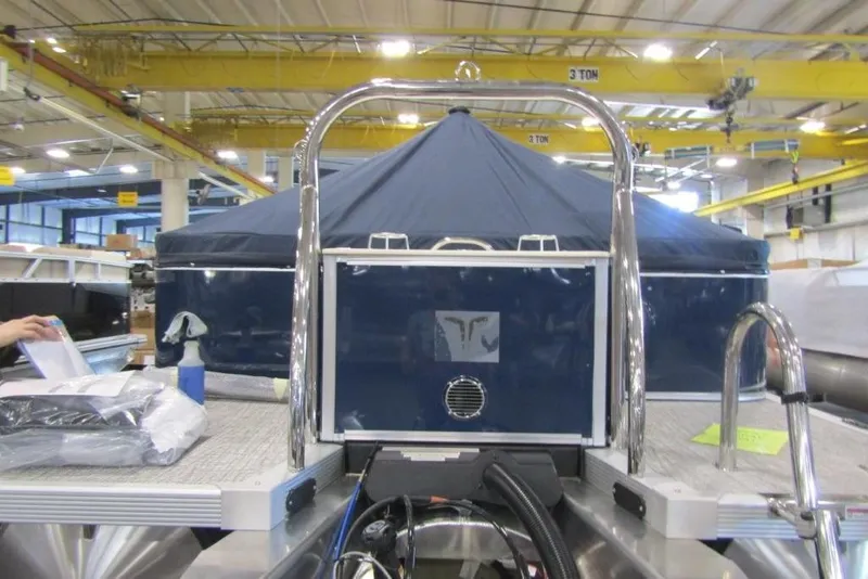 Slide: The Image of 2026 Tahoe Pontoon LTZ Quad Lounger 23 in a manufacturing facility. - 3
