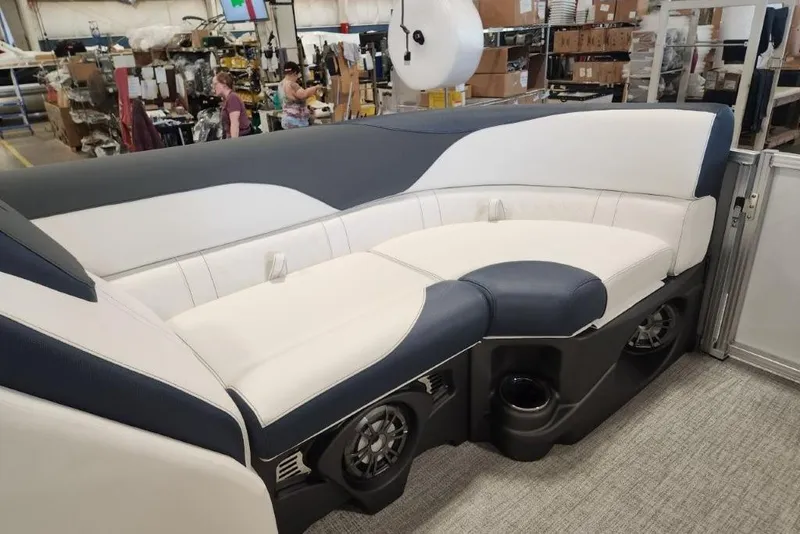 Slide: The Image of 2026 Tahoe Pontoon LTZ Quad Lounger 23 interior with plush seating and integrated speakers. - 6