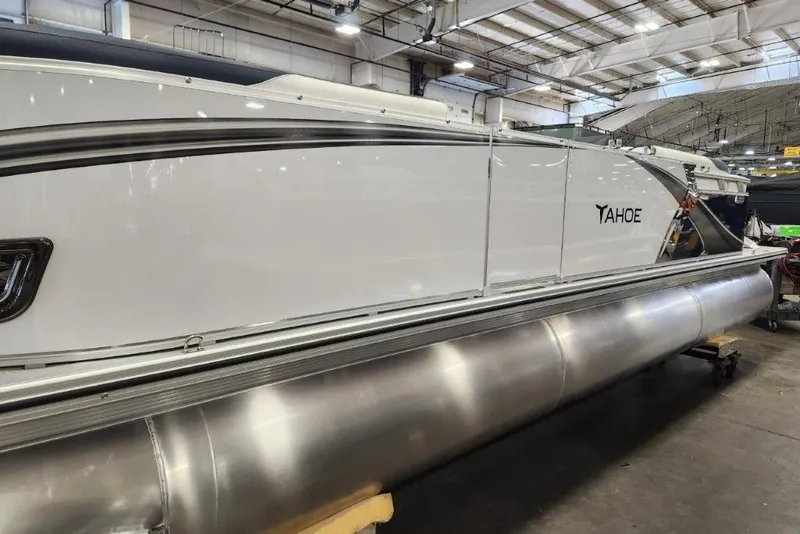 Slide: The Image of 2026 Tahoe Pontoon LTZ Quad Lounger 23 in a showroom setting. - 9