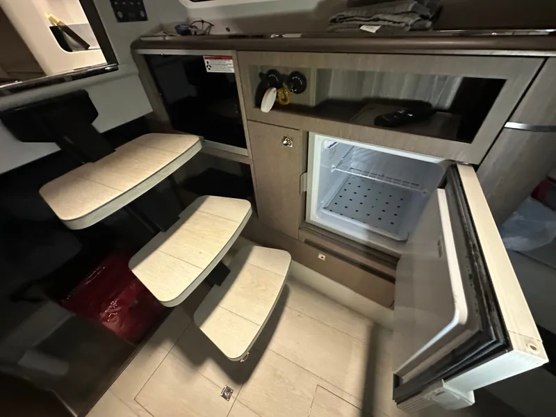 Slide: The Image of Interior of 2024 Galeon 325 GTO with fridge and stairs. - 13