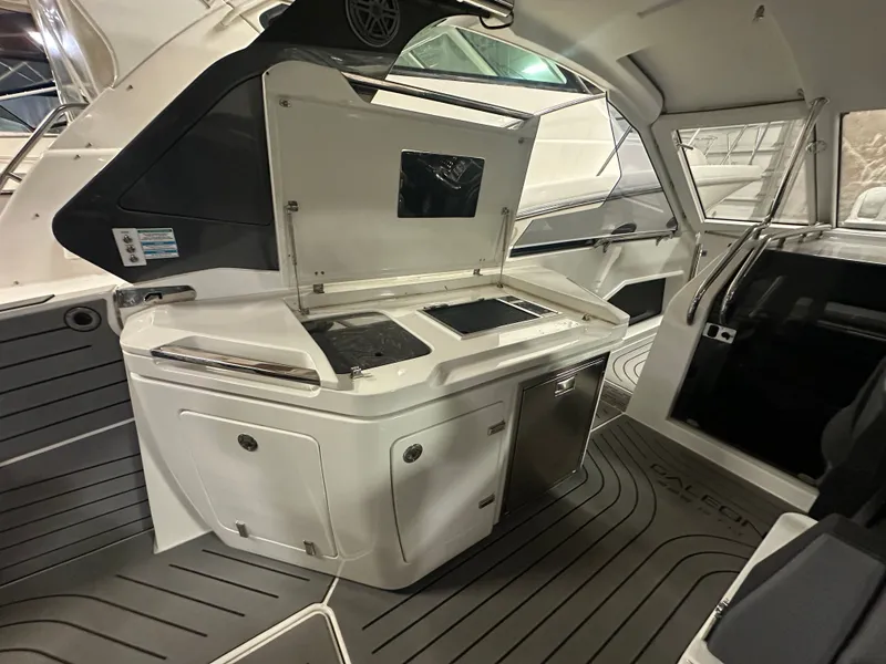 Slide: The Image of Interior of 2024 Galeon 325 GTO featuring modern kitchenette. - 5