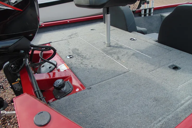 Slide: The Image of 2024 Tracker Pro Team 175 TF boat deck with seating and storage compartments. - 11